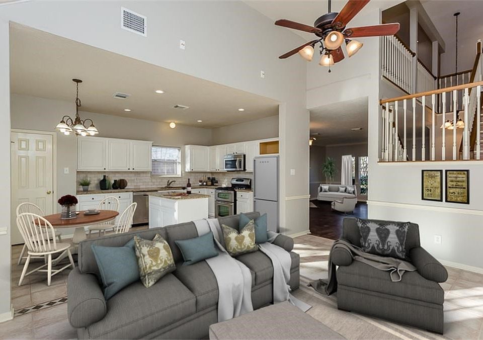 Family Room is open to the Kitchen. Natural light floods the Family Room and Kitchen.