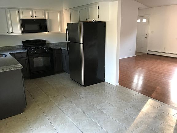 The kitchen with living room view. You can see the front door in this shot.
