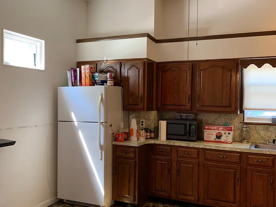 Kitchen Has plenty of cabinets and drawers for storage.
