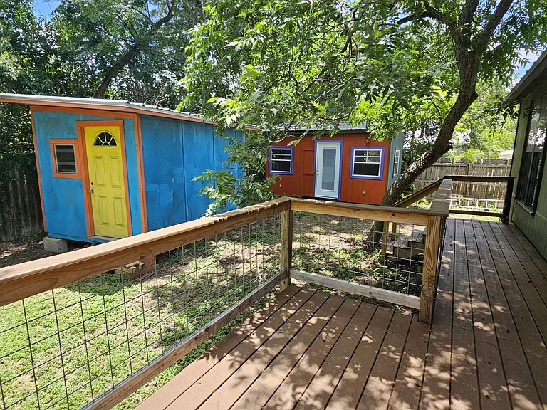 Fenced in Backyard with Deck and 2 Sheds