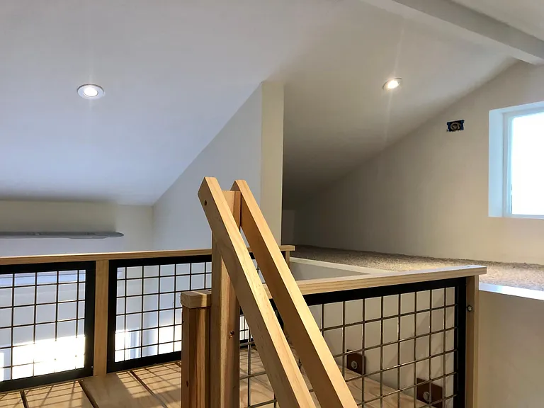 bridge between bed and storage loft