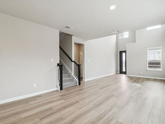 Living room in the Medina floorplan at a Meritage Homes community.