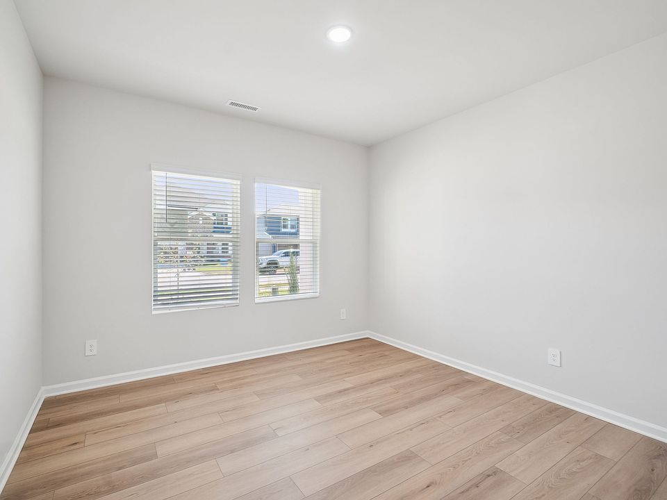 Secondary bedroom in the Taylorsville floorplan at a Meritage Homes community in Garner, NC.