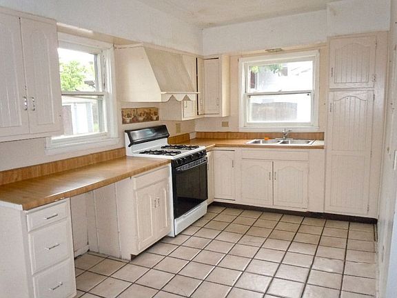 Kitchen with Generous Cabinets and Maple Counters