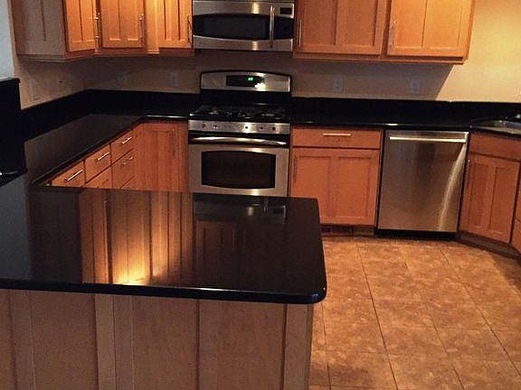 Kitchen with stainless steel appliances and gas stove