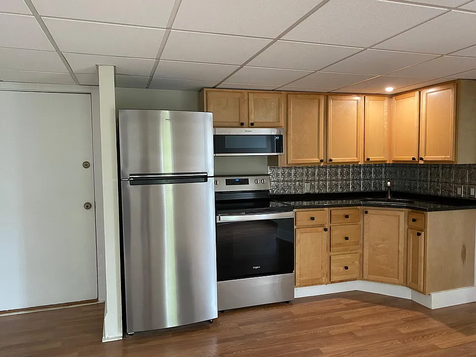 Open concept kitchen with new stainless appliances