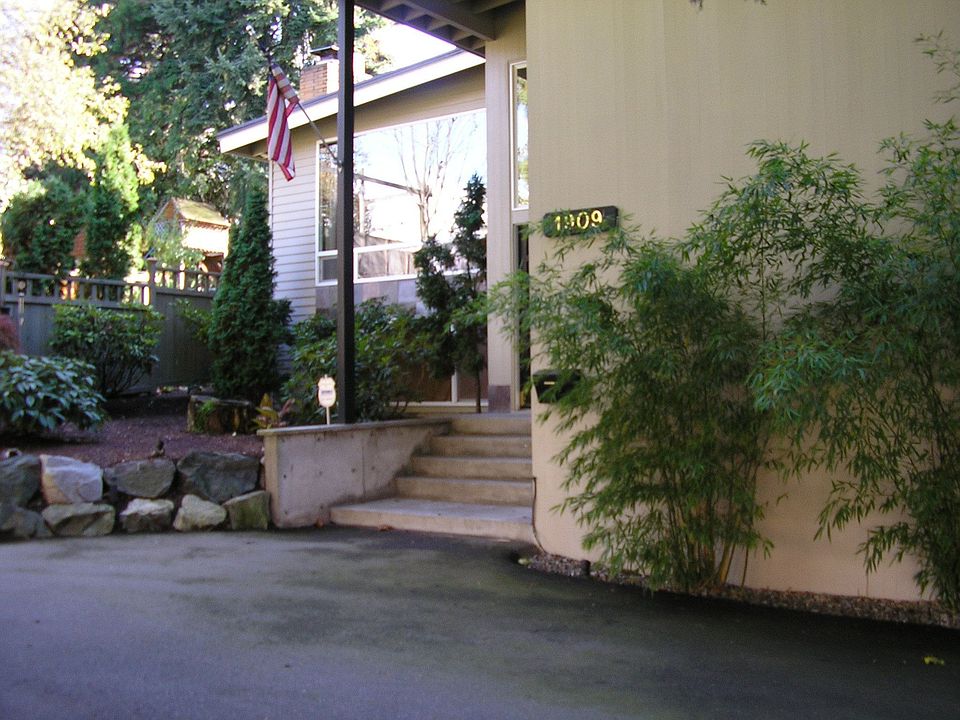 Inviting front driveway features room for 2+ cars