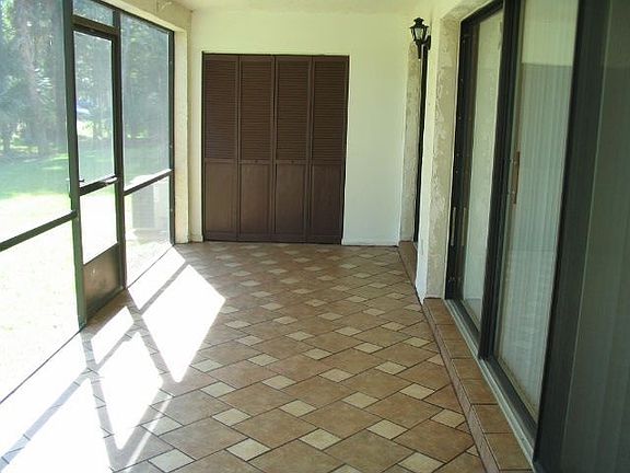 Large tiled, screened porch