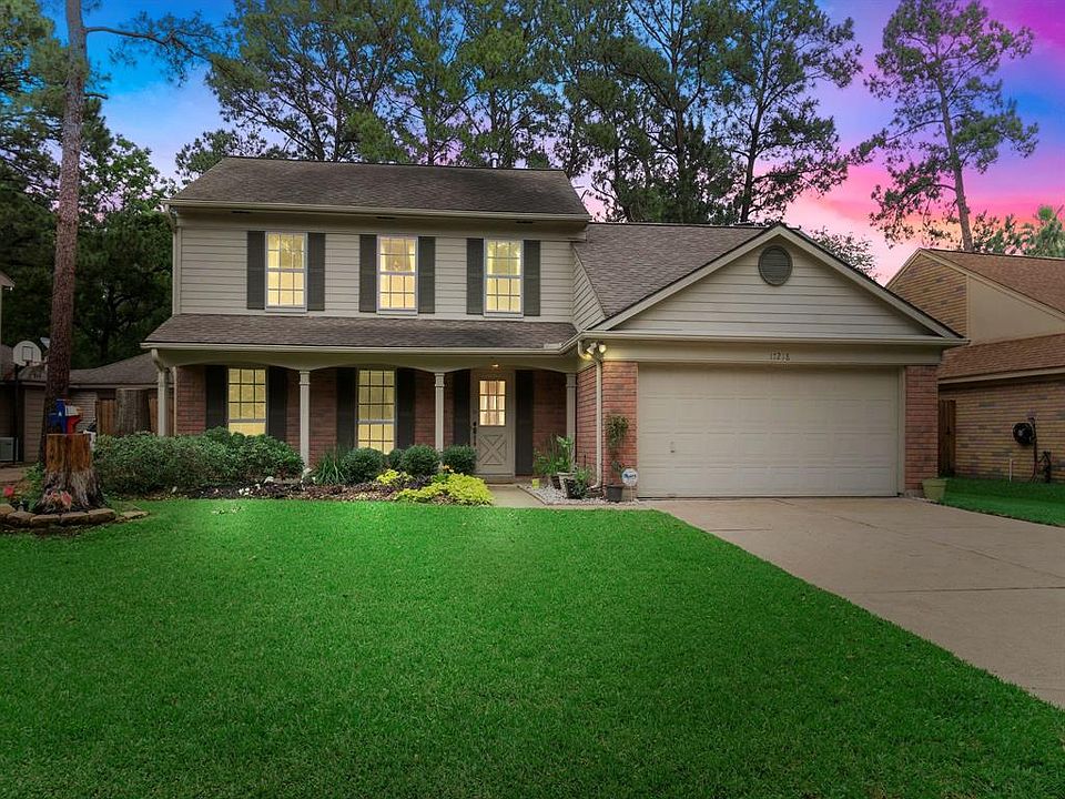 WELCOME HOME! This charming cottage-style home with a front red-brick elevation is surrounded by beautiful tall oak trees and a gorgeous manicured lawn; the perfect setting to watch sunrises and sunsets from your covered front porch.