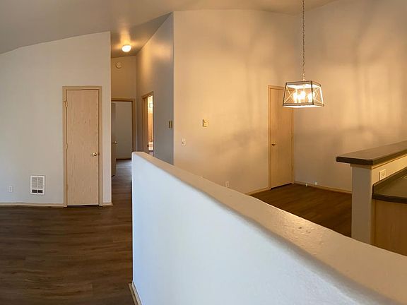 Divided kitchen, dining room and living room.