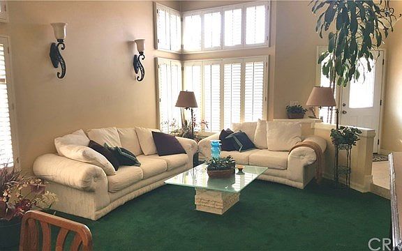 Cathedral ceilings and an abundance of windows allow plenty of light to adorn the formal living and dining areas.