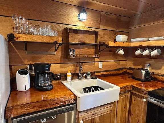 Coffee maker, toaster and all flatware, glass wear and dishes.