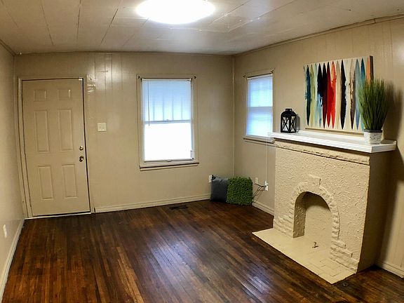 Living Room with Decorative Fireplace