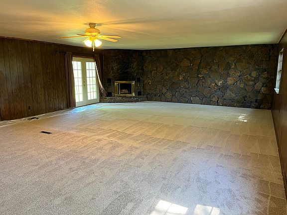 Large room with gas fire place. Room for full dining and living room.
