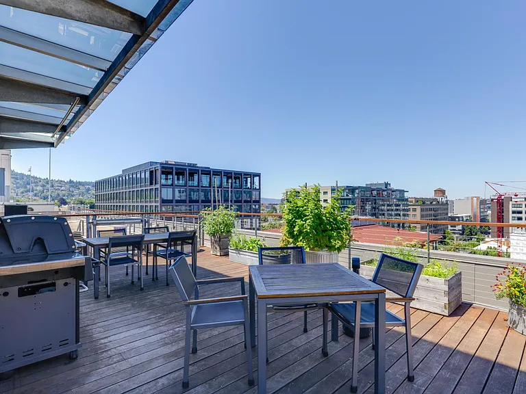 Rooftop patio with barbeque grills and 360 degree views