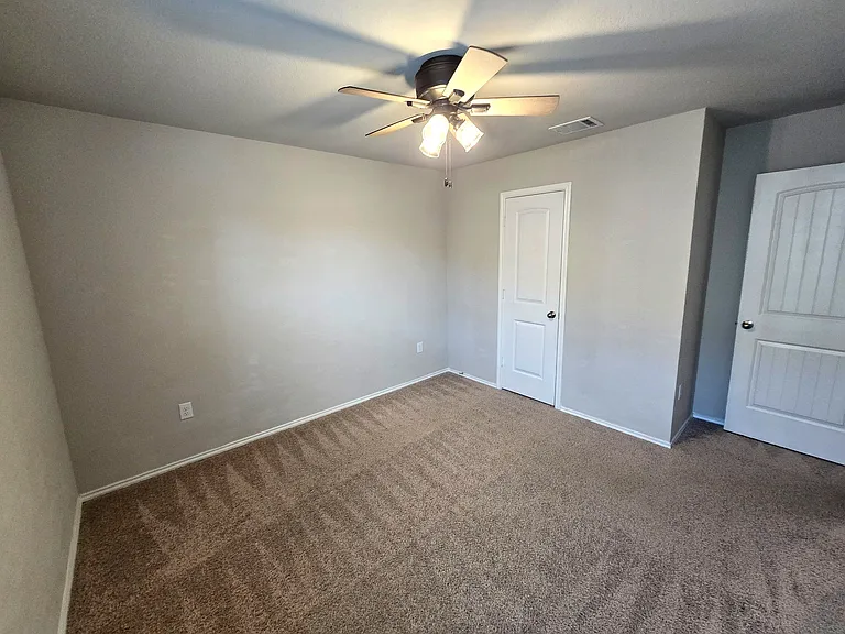 Bedroom 3: Bright bedroom with flexible use for children, guests, roommates or homeschool setup.