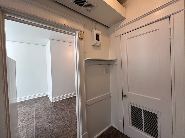 This door leads into the walk through closet.