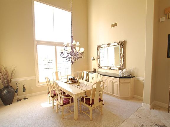 Formal dining room with cathedral ceilings