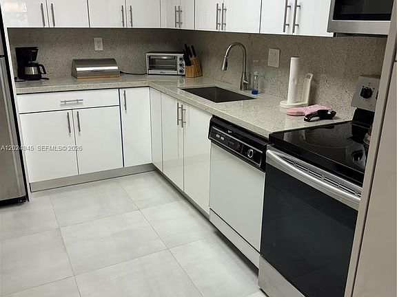 2nd image of 3600 Mystic Pointe Dr APT 208