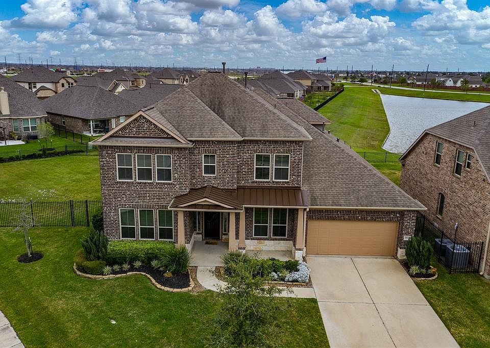 Situated on a corner lot with an incredible lake view, this home's location in the esteemed master planned community of Canyon Lakes West, could not get better!