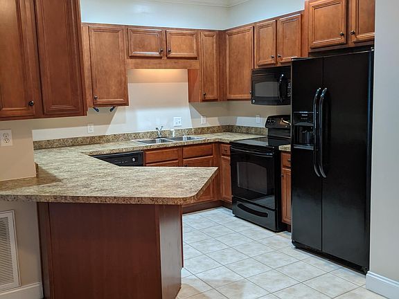 Kitchen has plenty of counter and cabinet space. Over range micro, side by side fridge, glass top range., dishwasher and disposal.