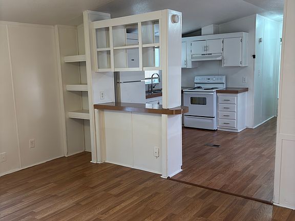 Living room opens into the kitchen