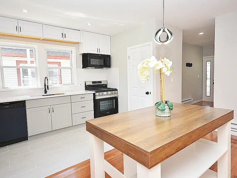 Kitchen with moveable island that seats 2.