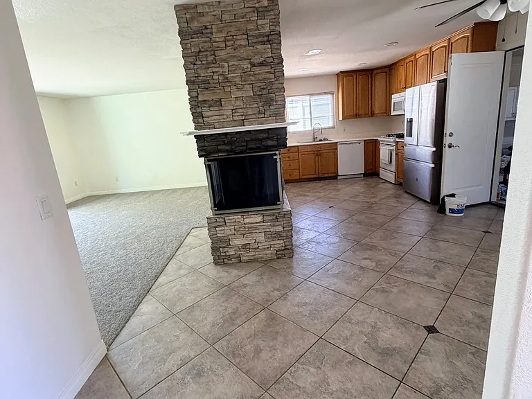 Living room and kitchen. Fireplace 3 sided viewing