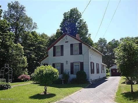Front with driveway and garage