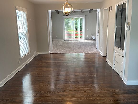 Open concept main floor. View from living room into dining room and family room.