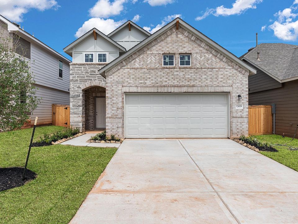 Welcome home to 12878 Lime Stone Lane located in the Stonebrooke community and zoned to Conroe ISD