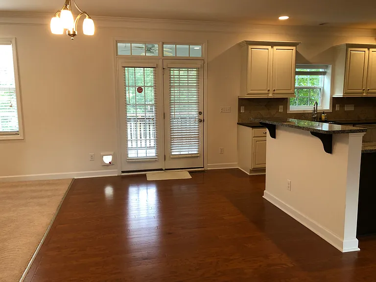 kitchen breakfast area opens to screen porch