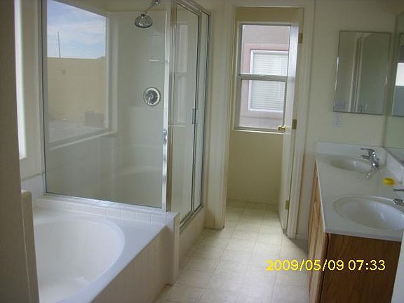 Master bathroom with double sink and seperate shower and tub