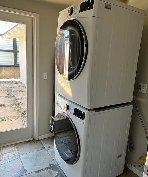 New stacked washer/dryer included