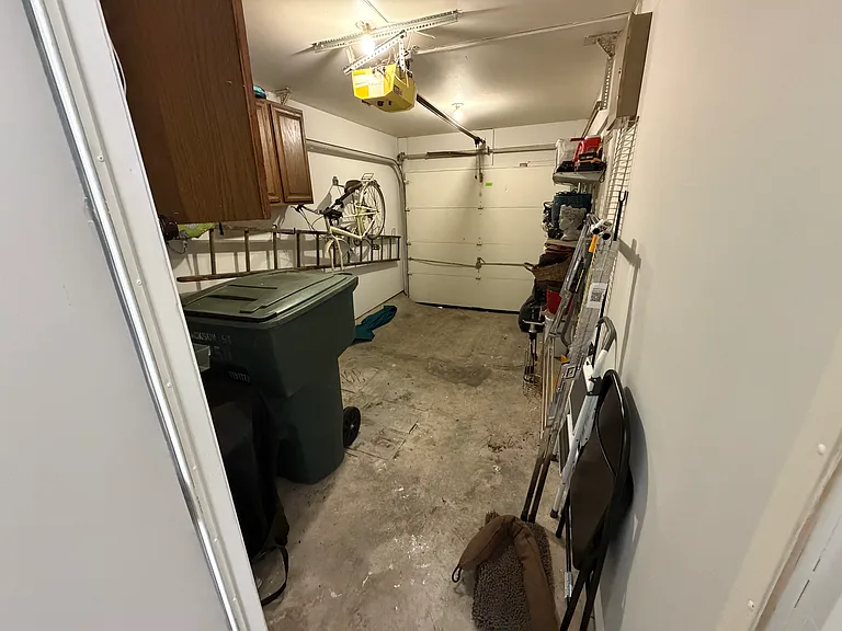 Garage with loads of cabinets and shelves