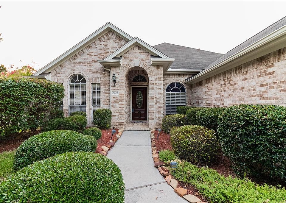 Welcome home to 9222 Colonyway Court! This stunning home has lovely curb appeal, a well-manicured lawn, beautiful landscaping, brick elevation, dark stained front door, covered front porch, beautiful outdoor lanterns, and a double wide driveway!