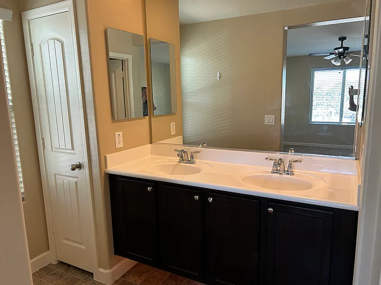 Dual sinks in primary bathroom