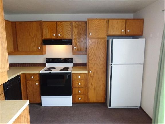 Kitchen with stove, refrigerator, and dishwasher