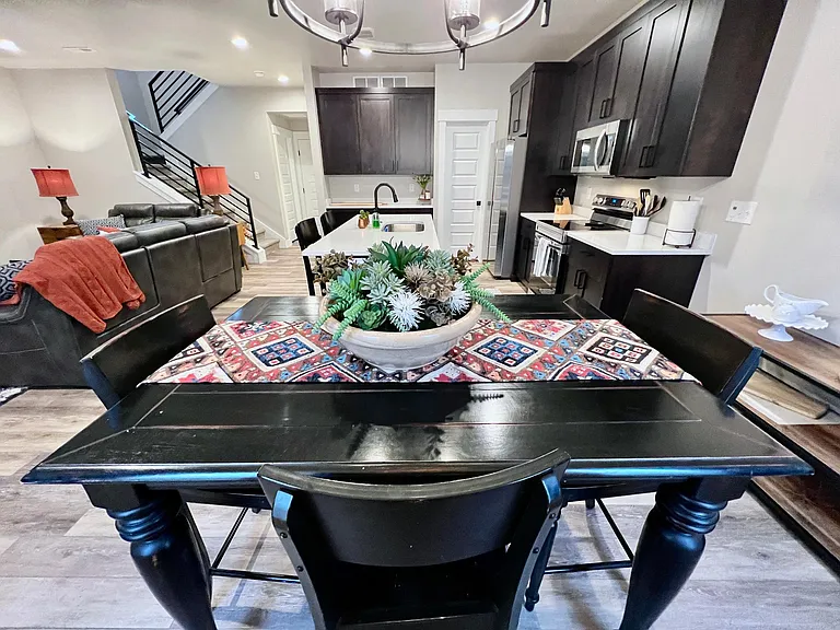 Chairs from kitchen bar work for this table.