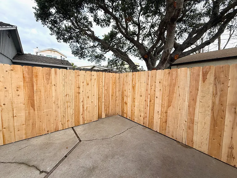exterior of the patio fencing that leads to the studio entrance