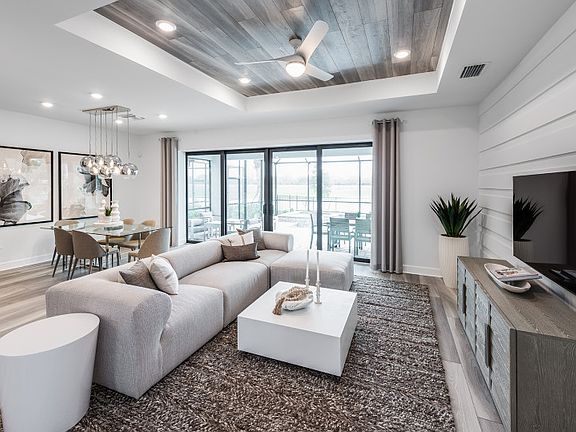 Gathering room with sliding glass doors to outdoor living space