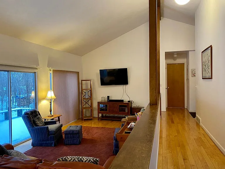 Living room and hall to primary bedroom.