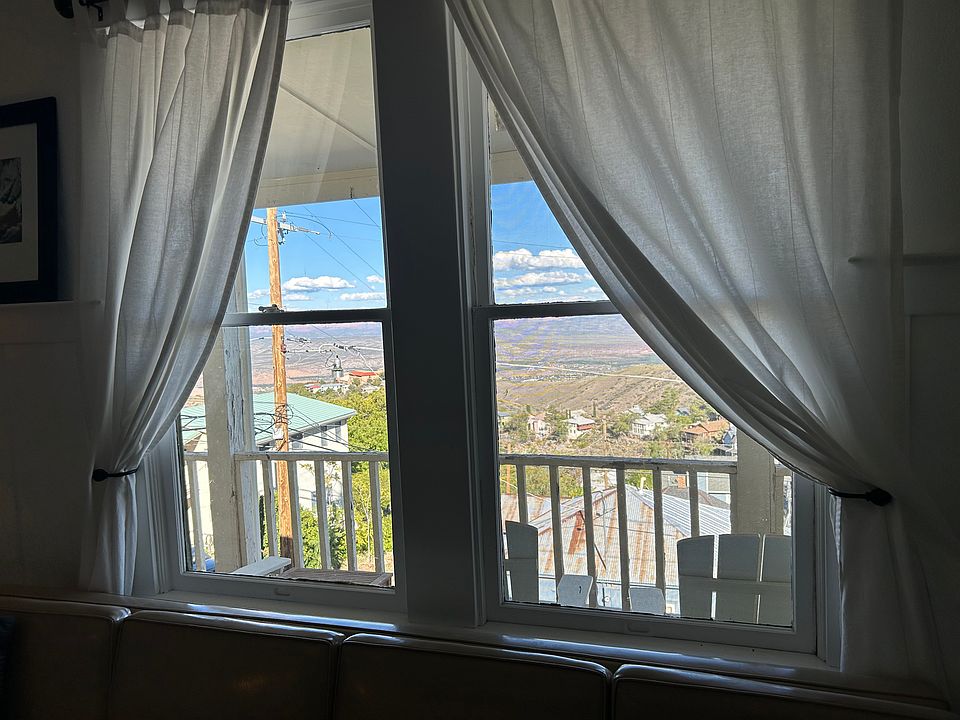 Gorgeous Views of Jerome from this Top Floor Apartment, featuring private access to your own wrap-around porch.
