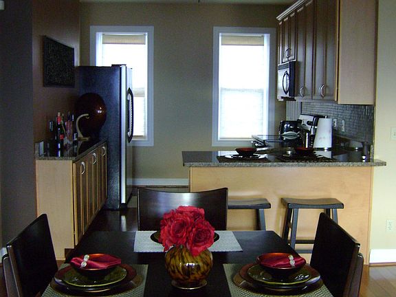 Hardwood continued throughout with granite and stainless steel apps in kithcen