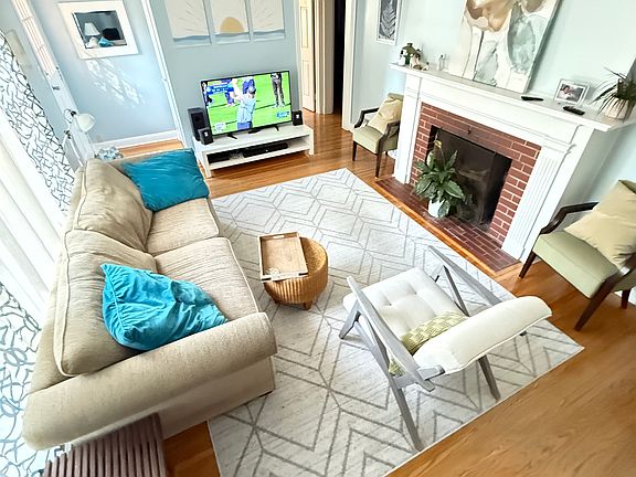 Living room with plenty of seating and fireplace