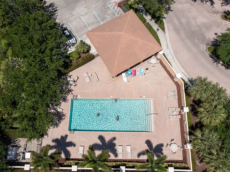 Aerial view of community pool and bath house. Only 50 units in the community allowing few pool users when you want to swim or layout!
