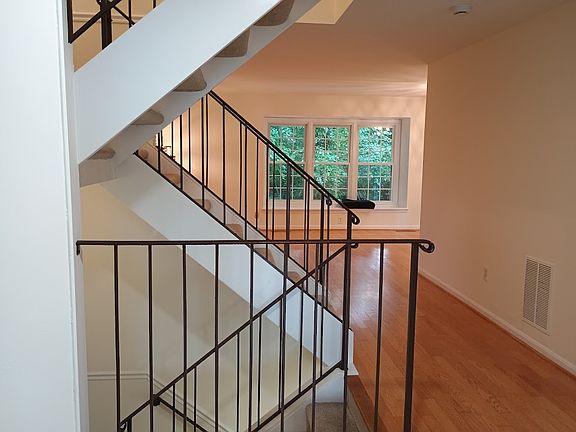 Open feel with view of woods. New carpet on stairs as of 09/23/2026.