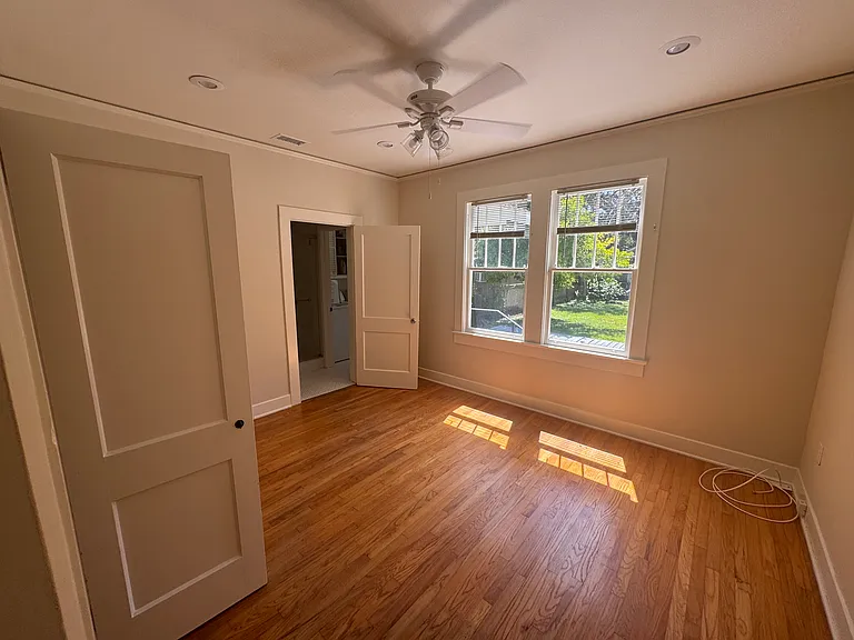 Bedroom 2 with backyard views and entrance to bathroom and laundry room