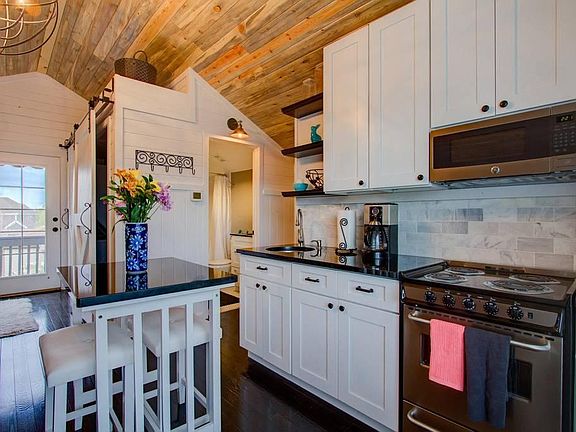 Magazine-worthy carriage house, fully furnished. At 550 sq ft this would be a giant TINY HOME