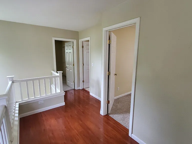 Hallway looking to front bedroom and bathroom